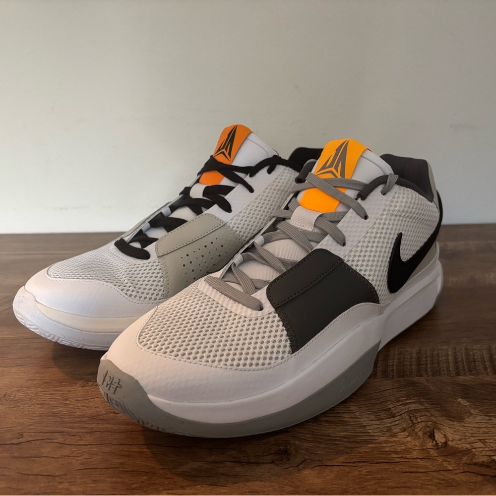 White and Black Athletic Sneakers with Orange Accents
